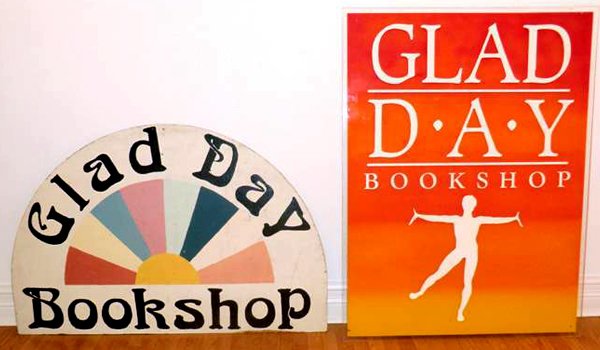 The ArQuives collection houses two signs advertising the bookshop. One is hand-painted by Jearld Moldenhauer (left), while the other was initially produced for Glad Day’s Boston location (right).