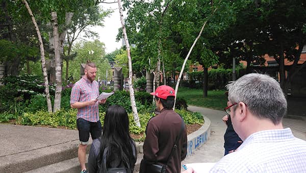 The ArQuives Community Engagement Committee Member, Douglas Haines starts the Heritage Walking Tour at AIDS MEMORIAL – Barbara Hall Park