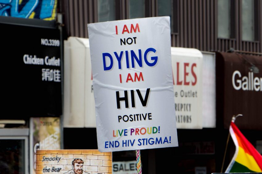 By Asha Collins, Parade Day; June 24 - Poster written with the statement saying “I am not DYING I am HIV positive / LIVE PRIDE / End HIV STIGMA!”