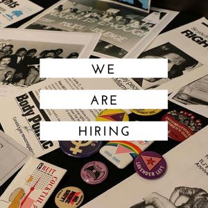 Text: We are Hiring. Image: Includes some The ArQuives display materials including buttons and pamphlets.