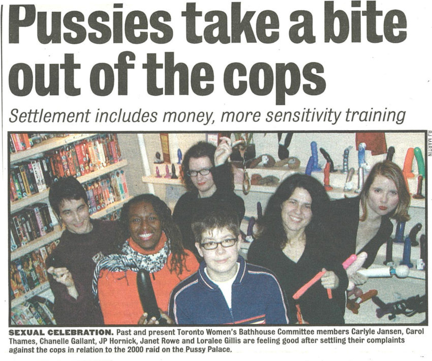 Newspaper clipping with the headline “Pussies take a bite out of the cops” and a photo of members of the Toronto Women’s Bathhouse Committee.