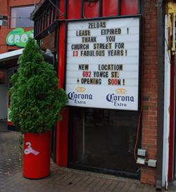 Sign in front of Zelda’s on Church Street announcing the lease expired and they were moving to Yonge Street.