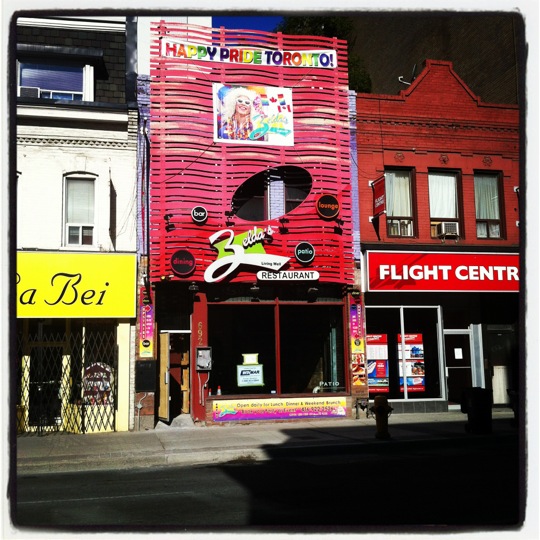 Street level photograph of Zelda’s Living Well Restaurant on Yonge Street with a for lease sign following its closing.
