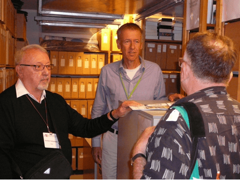 Gordon Richardson, Jack van der Wel, and Joseph Hawkins (ONE) on tour in the basement storage area of IHLIA. Credit: Don McLeod.