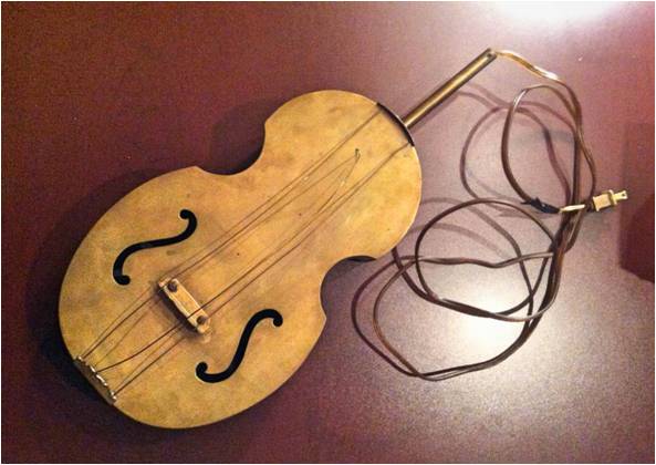 Violin-shaped metal lamp from St. Charles Tavern (photo credit: Michael Holmes).