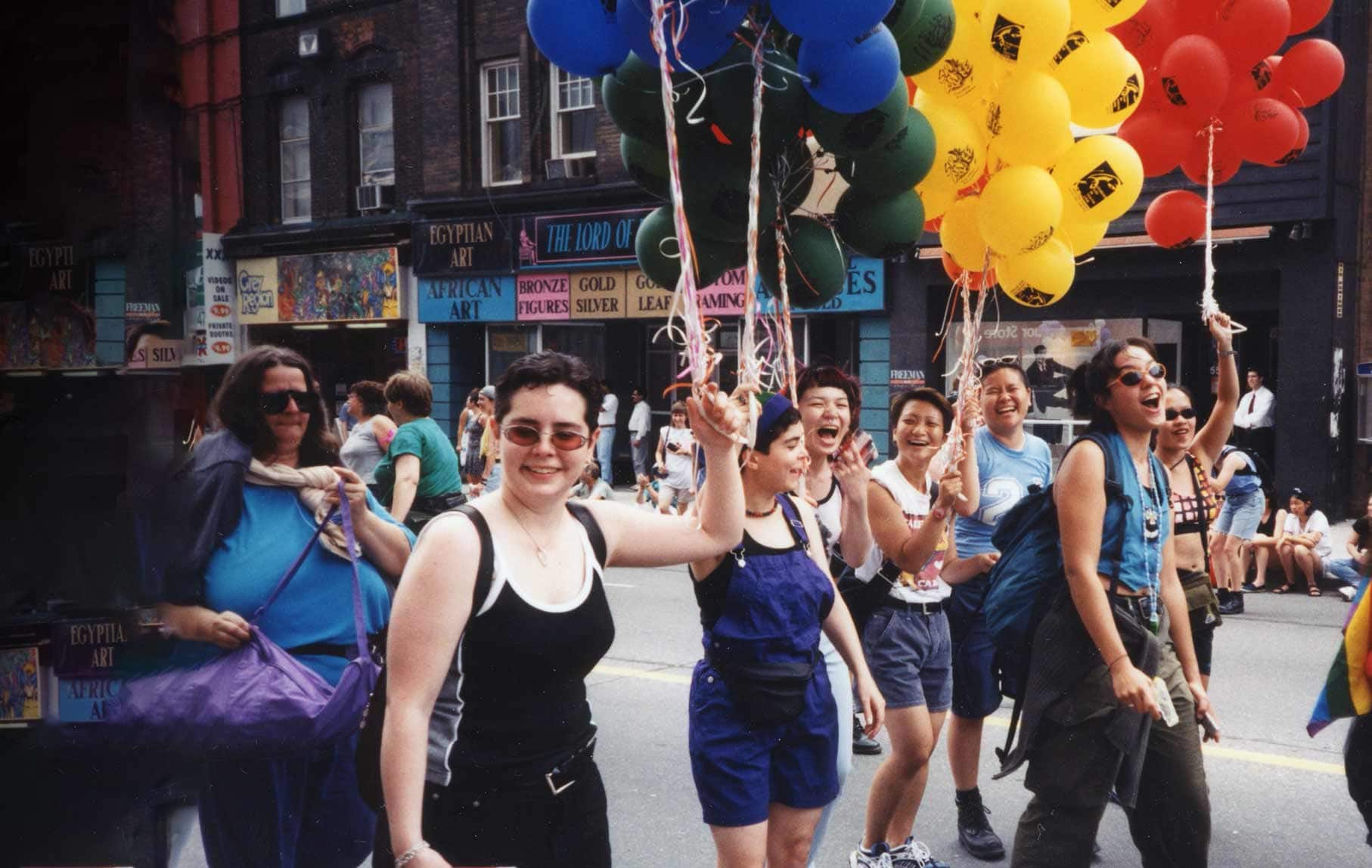 women marching pride parade