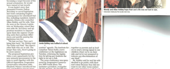 Clipping of a newspaper article with a photo of a teenager with shaggy hair in a graduation gown, and a separate photo of a middle-aged couple