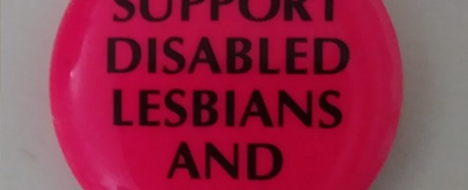 Pink button reading “I Support Disabled Lesbians and Gays”