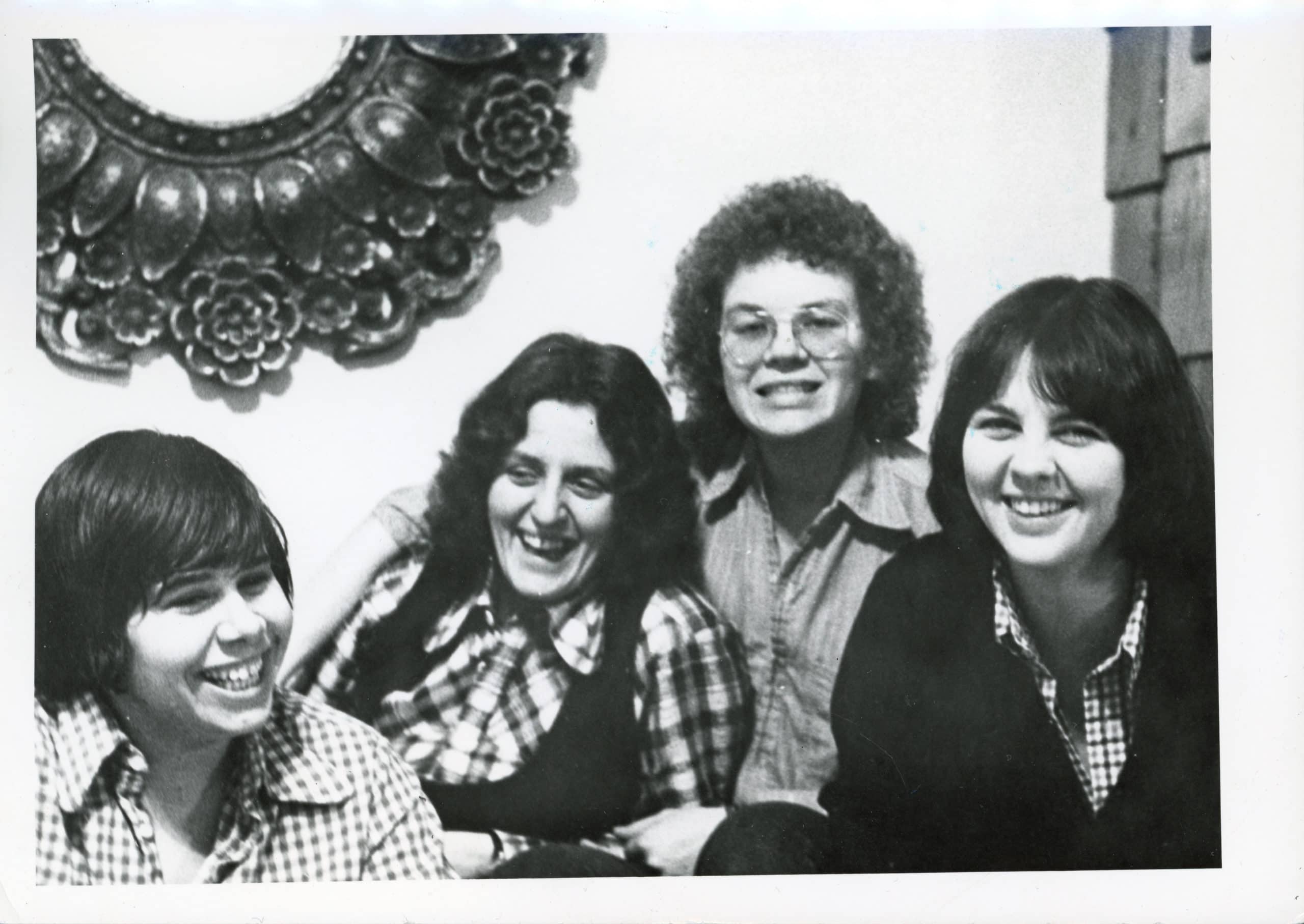 Photo of four smiling women