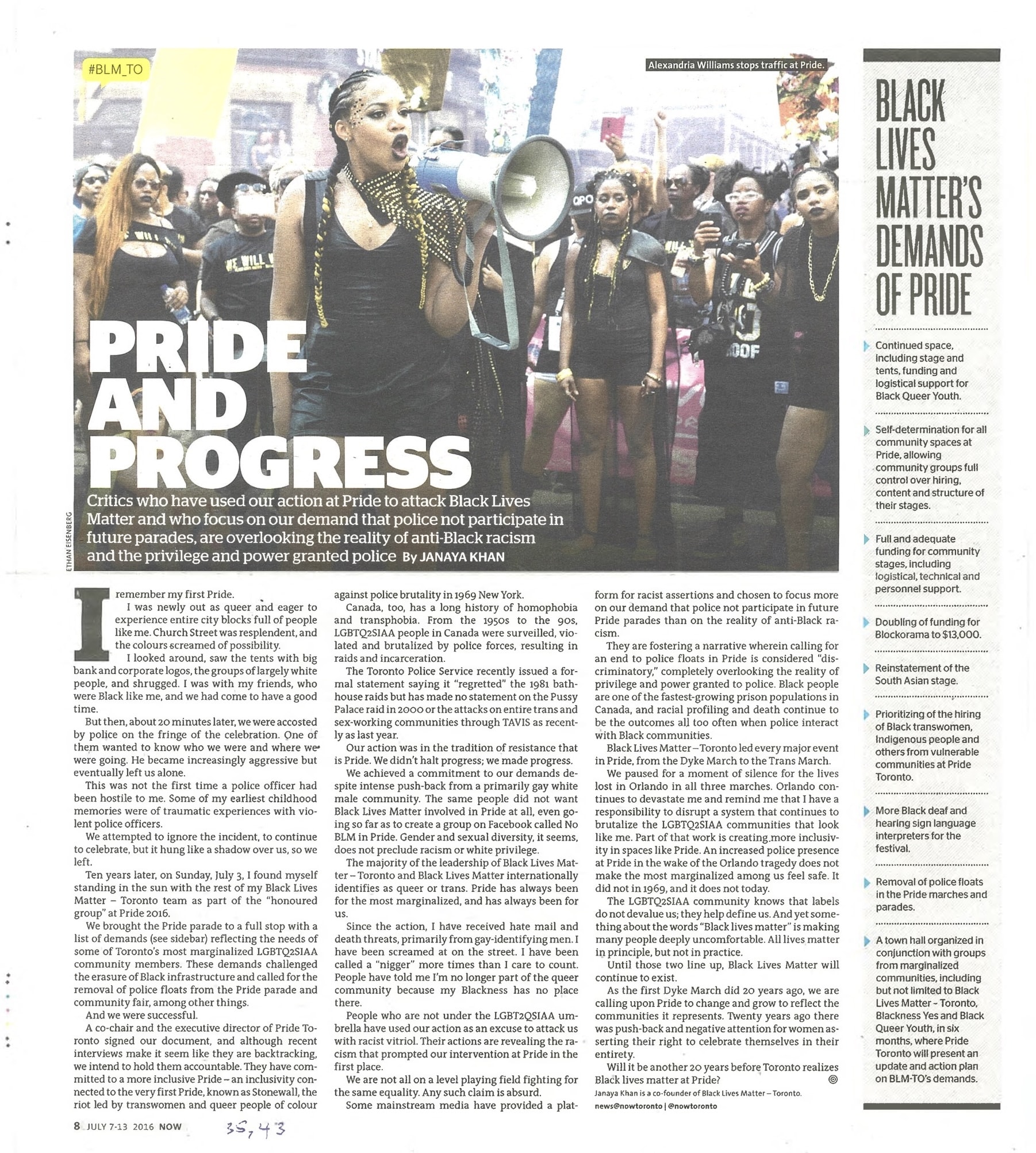 Page from a newsmagazine, including a photo of a person with braided hair and a black dress speaking into a megaphone. Behind them, several other people, most of whom are also dressed in all black, are standing next to one another in a line.